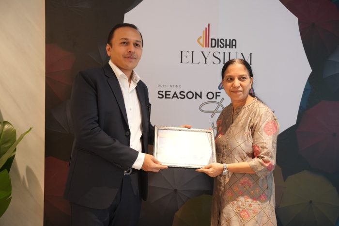 Xtraspace receiving a certificate of appreciation at Disha Elysium